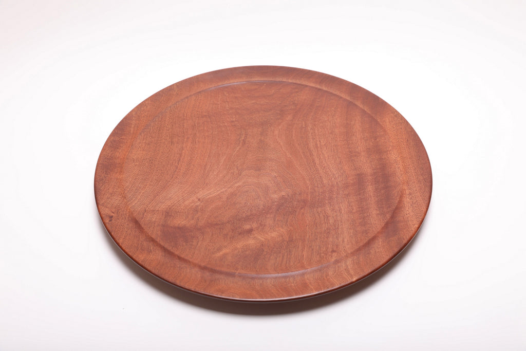 Large Khaya serving platter top view rotated 240°, African mahogany figure and undercut rim detail
