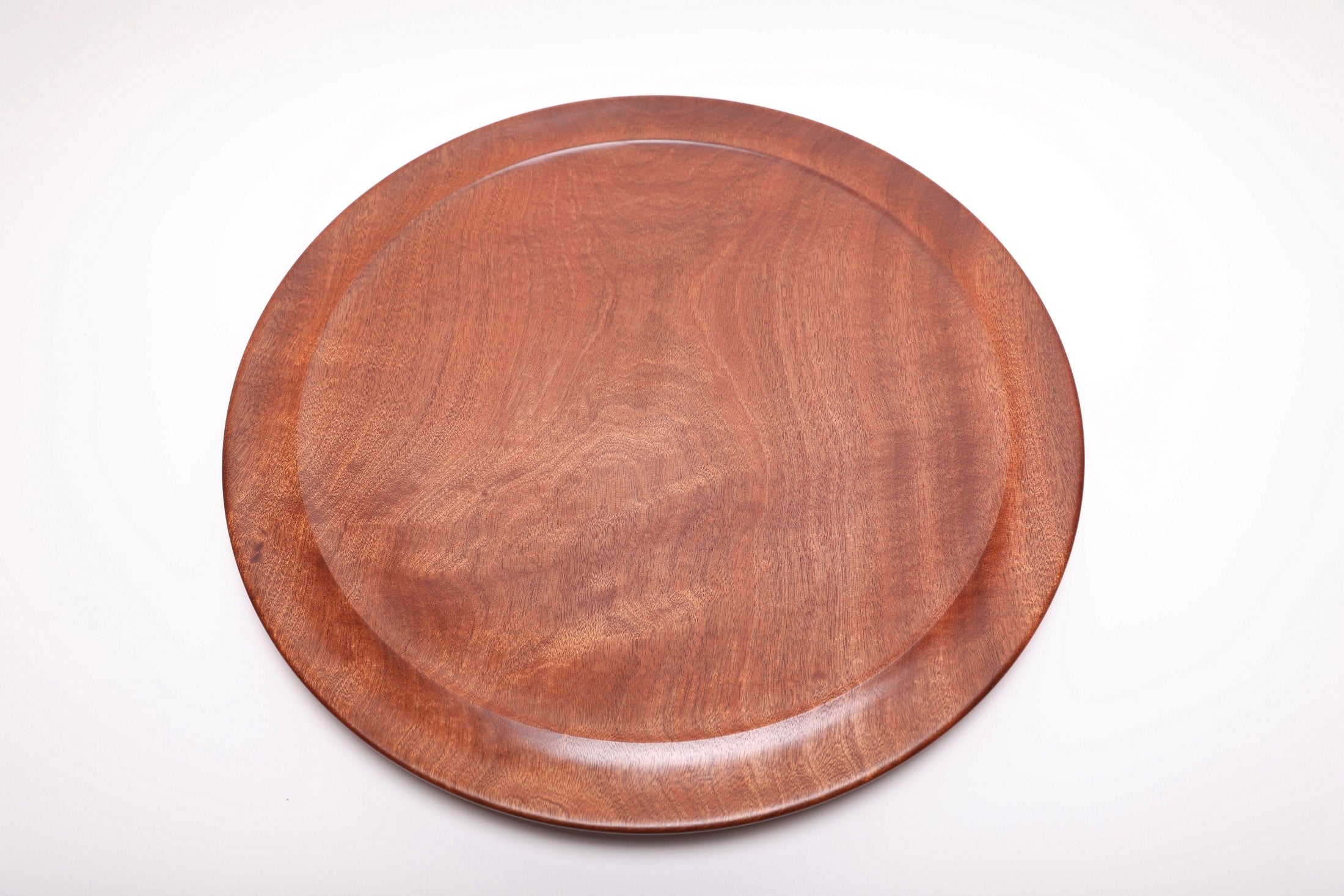 Large Khaya serving platter top view rotated 300°, handcrafted wood grain and food-safe finish