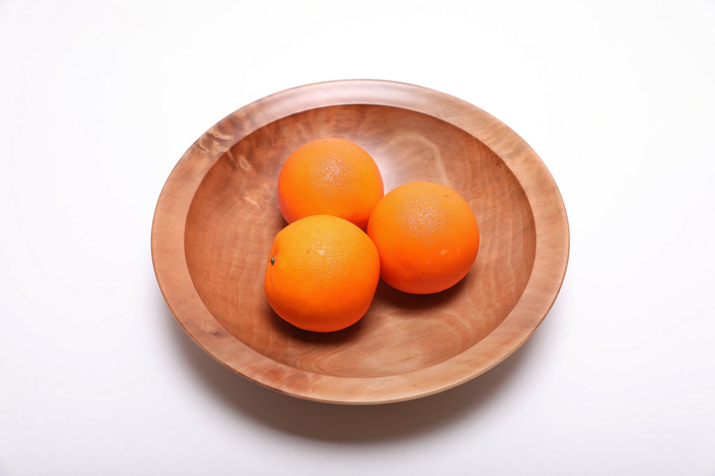 Sweet gum wooden bowl shown with three oranges for scale – 11 1/4" x 2 1/2" handcrafted wood serving bowl