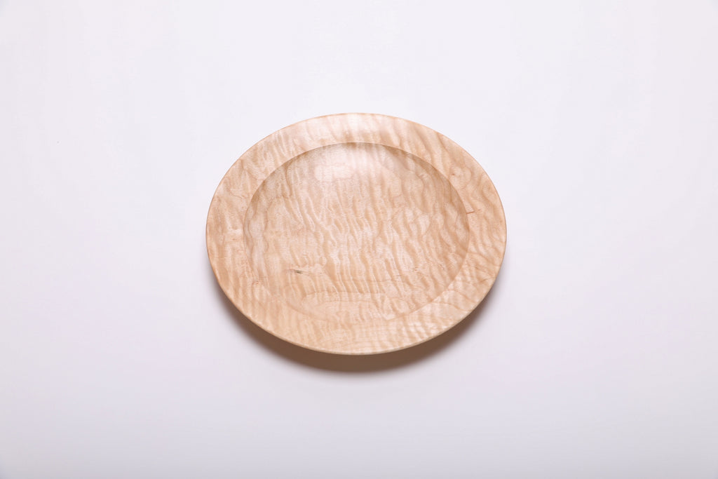 Handcrafted curly quilted maple shallow bowl, top view – rare chatoyant figure across entire surface, 7 3/4" diameter