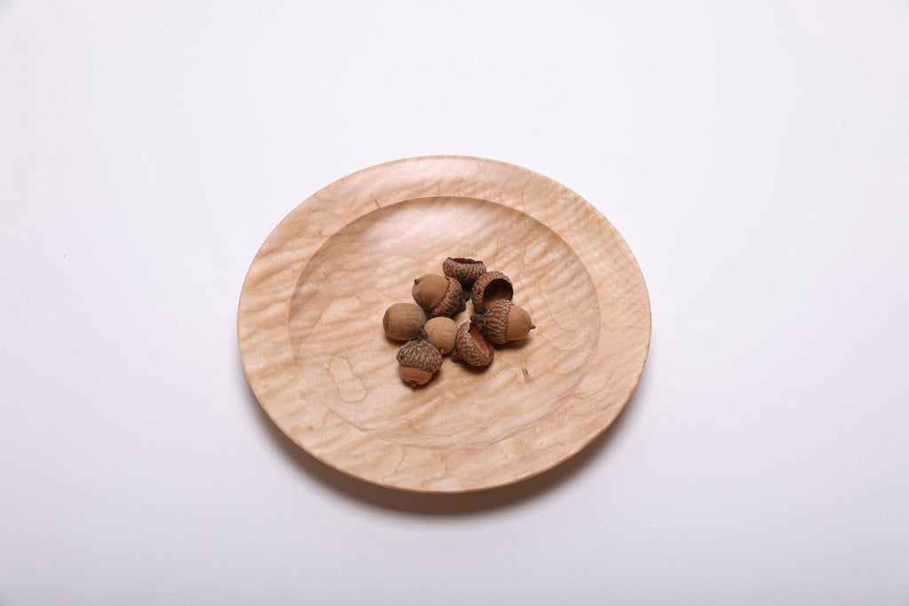 Curly quilted maple shallow bowl shown with acorns for scale – 7 3/4" x 1" handcrafted wood bowl