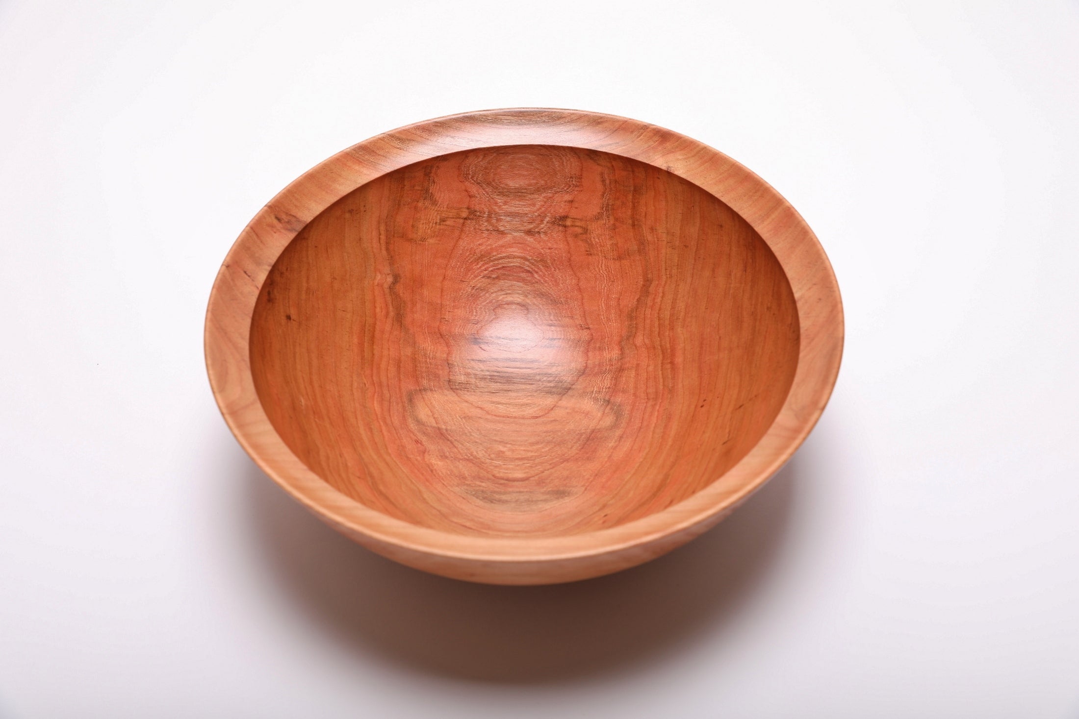 Handcrafted spalted wild black cherry fruit and salad bowl, top view – copper-pink tones with amber growth ring lines, 11 1/4" diameter