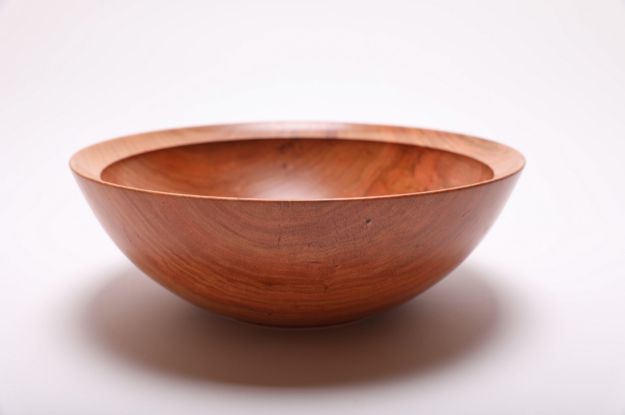 Spalted wild black cherry bowl side view rotated 180°, curved taper and raised foot detail
