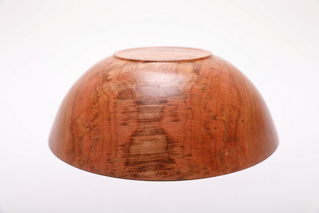 Bottom view of handcrafted spalted wild black cherry fruit and salad bowl showing raised foot and food-safe oil finish
