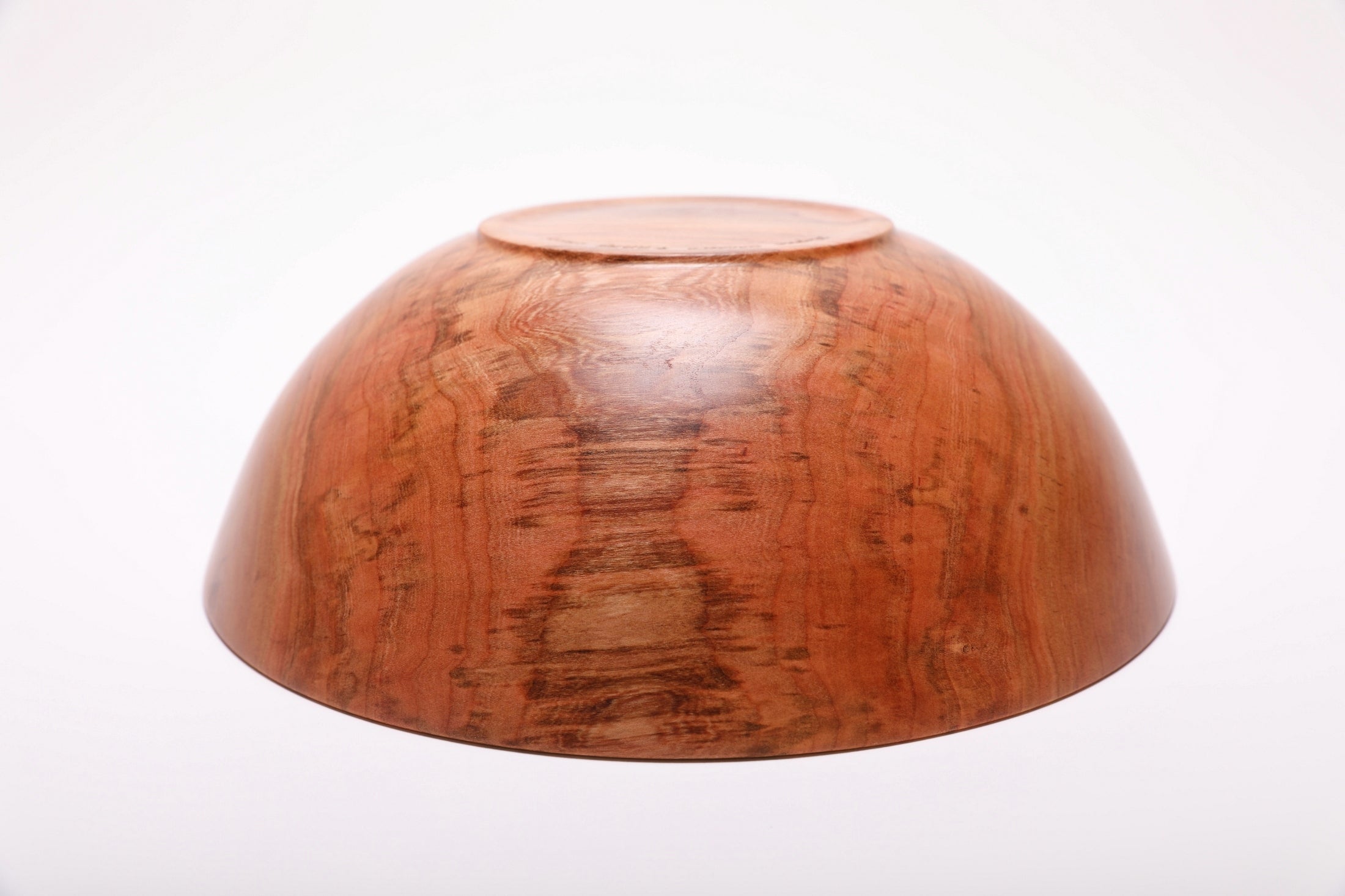 Bottom view of handcrafted spalted wild black cherry fruit and salad bowl showing raised foot and food-safe oil finish