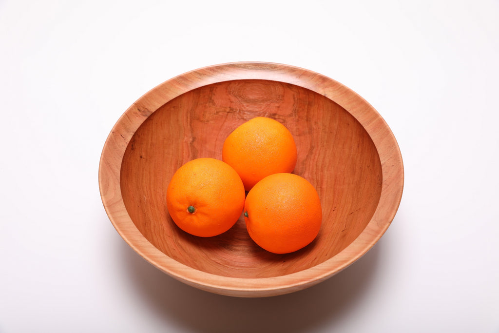 Spalted wild black cherry fruit and salad bowl shown with three oranges for scale – 11 1/4" x 4" handcrafted wood bowl