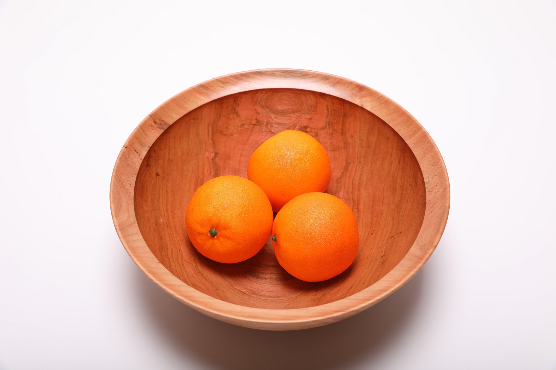 Spalted wild black cherry fruit and salad bowl shown with three oranges for scale – 11 1/4" x 4" handcrafted wood bowl