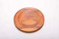 Pink ivory wood ring dish top view showing vibrant pink heartwood grain, hand-turned with food-safe oil finish, 7 1/4 inches diameter