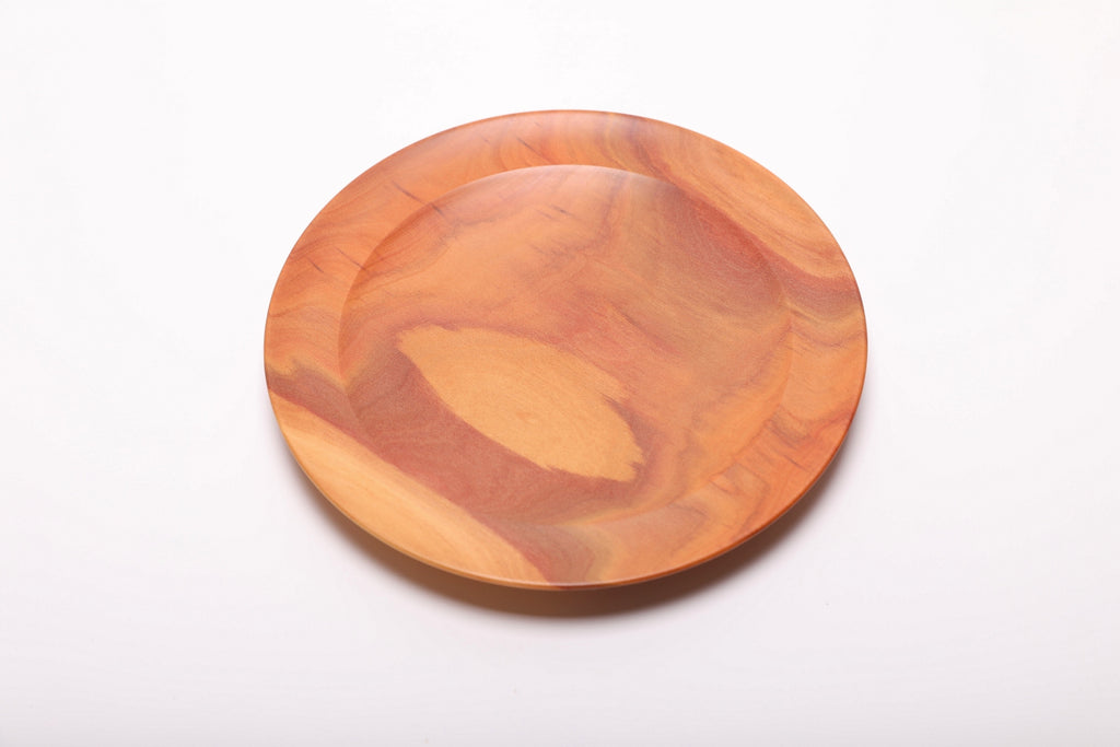 Top view of rare pink ivory wooden dish displaying rich pink and cream wood tones with smooth interior surface