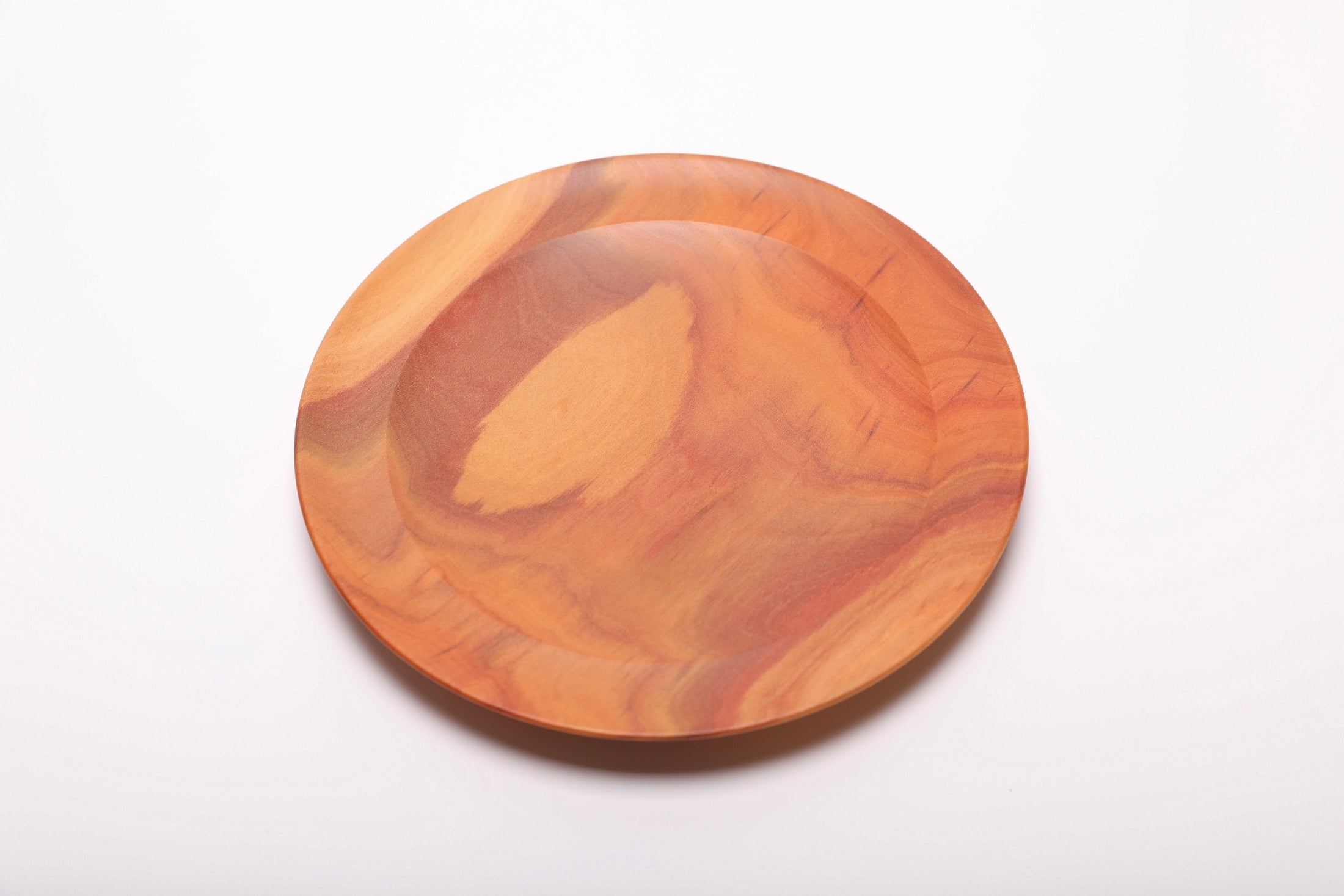 Top-down view of pink ivory ring dish highlighting deep pink color and fine grain detail, handmade in NC USA