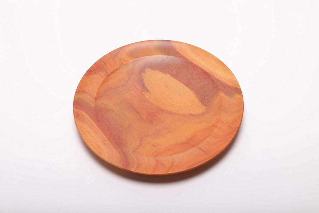 Pink ivory wood dish top view revealing natural color gradient from deep pink heartwood to lighter sapwood tones