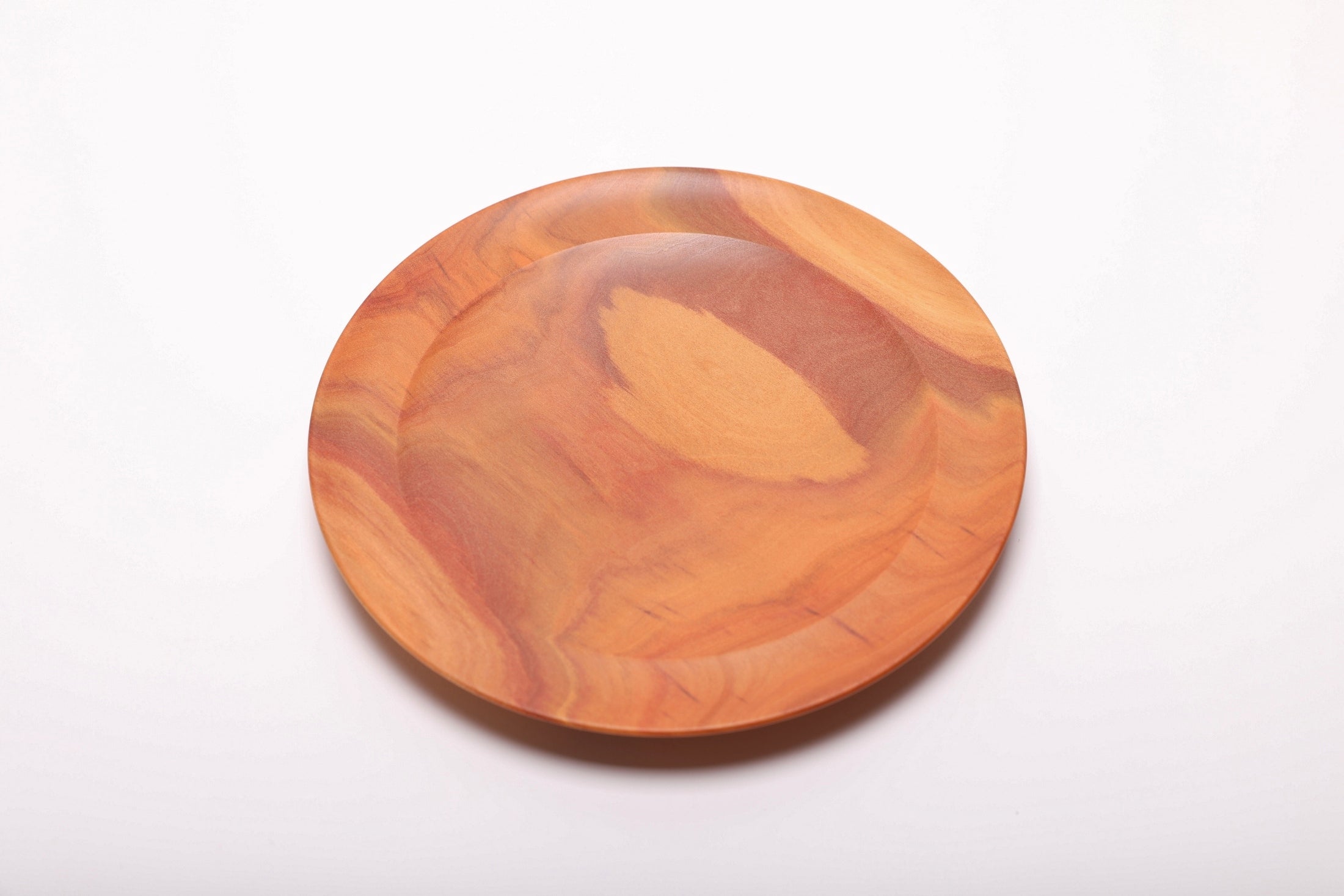 Pink ivory wood dish top view revealing natural color gradient from deep pink heartwood to lighter sapwood tones