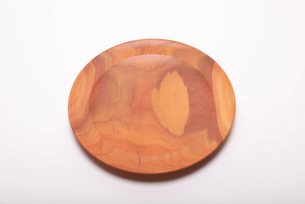 Overhead view of hand-turned pink ivory jewelry dish showing smooth interior finish and elegant rounded rim