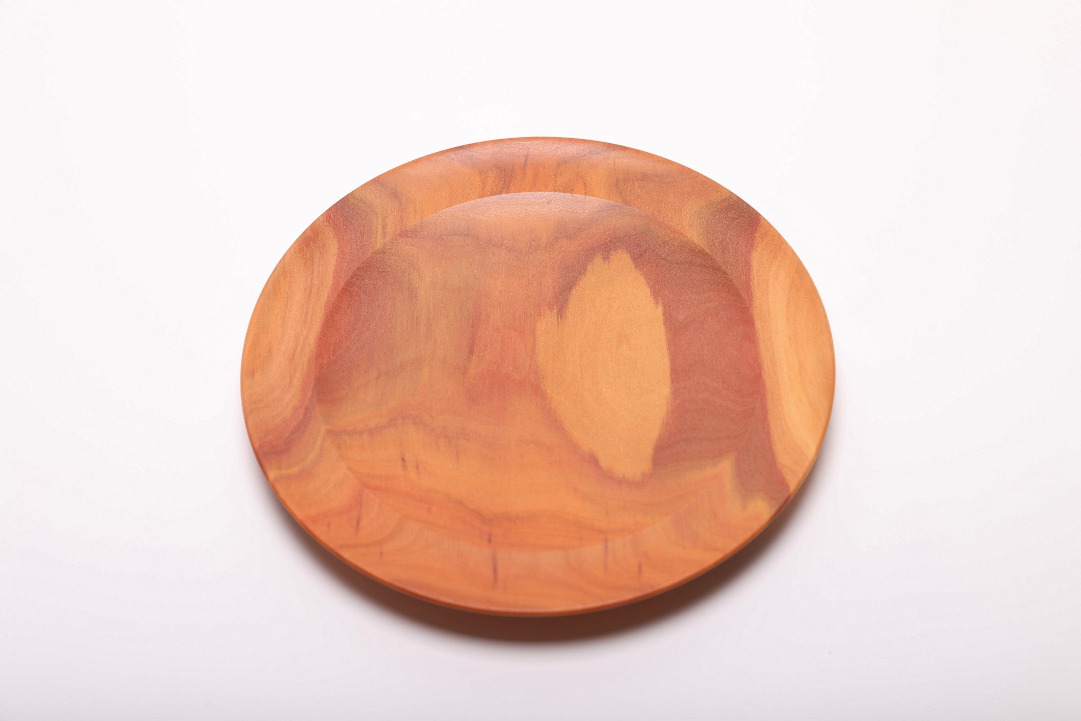 Overhead view of hand-turned pink ivory jewelry dish showing smooth interior finish and elegant rounded rim
