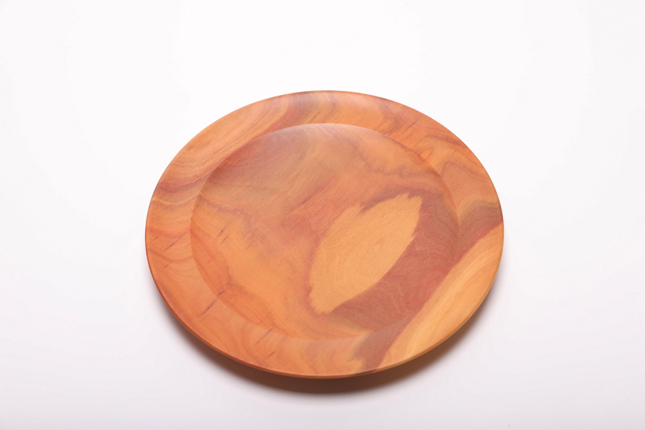 Top view of rare exotic pink ivory wood dish, one of the world's most valuable hardwoods, turned from 50-year-old stock