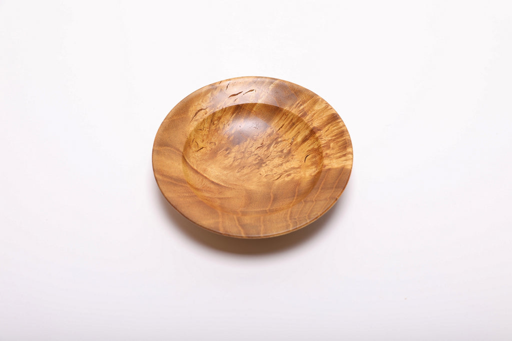 Overhead view of mulberry burl ring dish rotated 180 degrees showing full golden burl figure and smooth interior surface