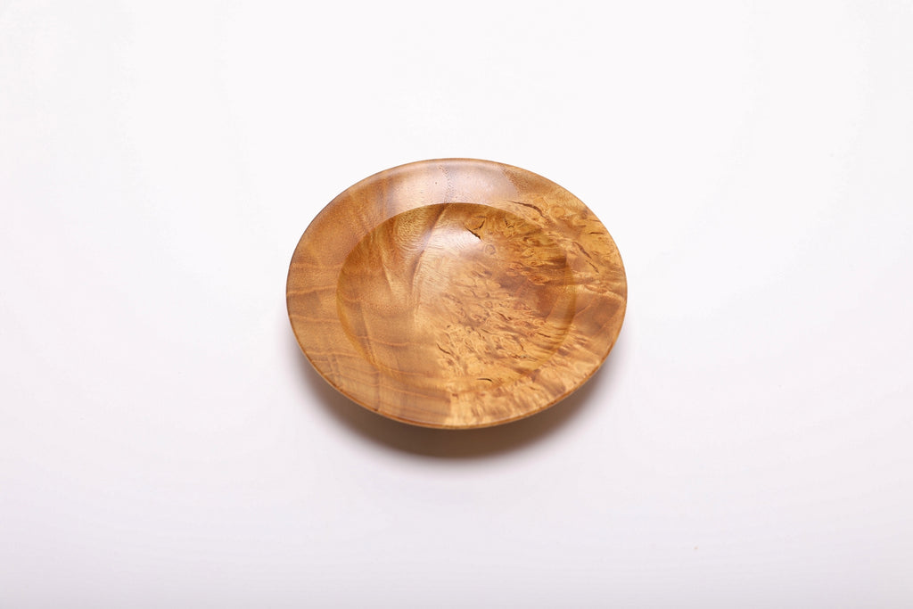 Top-down view of hand-turned mulberry burl dish rotated 270 degrees displaying contrasting birdseye and bamboo figure patterns