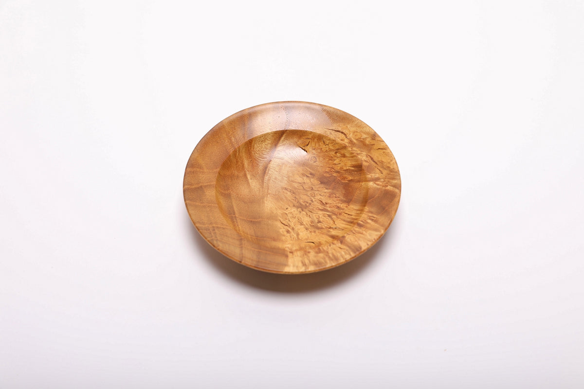 Top-down view of hand-turned mulberry burl dish rotated 270 degrees displaying contrasting birdseye and bamboo figure patterns