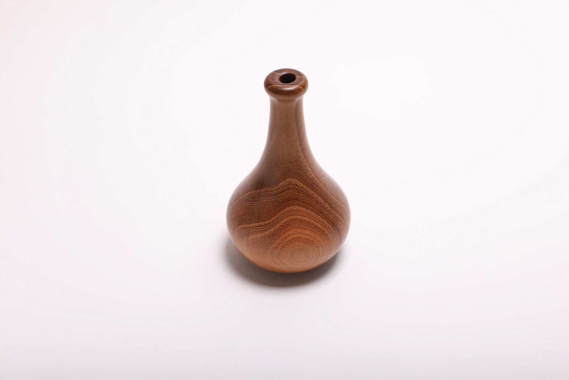 Black locust wood weed pot side view showing wide growth rings, slender neck, and natural oil finish, 3 5/8 inches wide by 5 3/4 inches tall