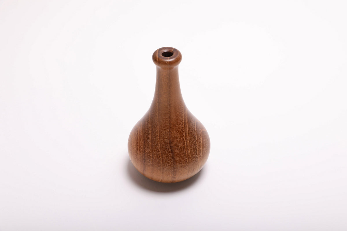 Side view of hand-turned black locust dry vase rotated 90 degrees revealing growth ring pattern and elegant tapered form