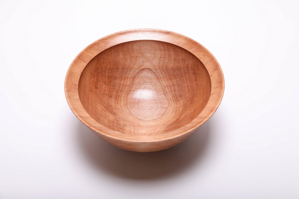 River birch wood bowl top view showing warm cinnamon coloration and iridescent grain, hand-turned with food-safe oil finish, 8 1/8 inches diameter