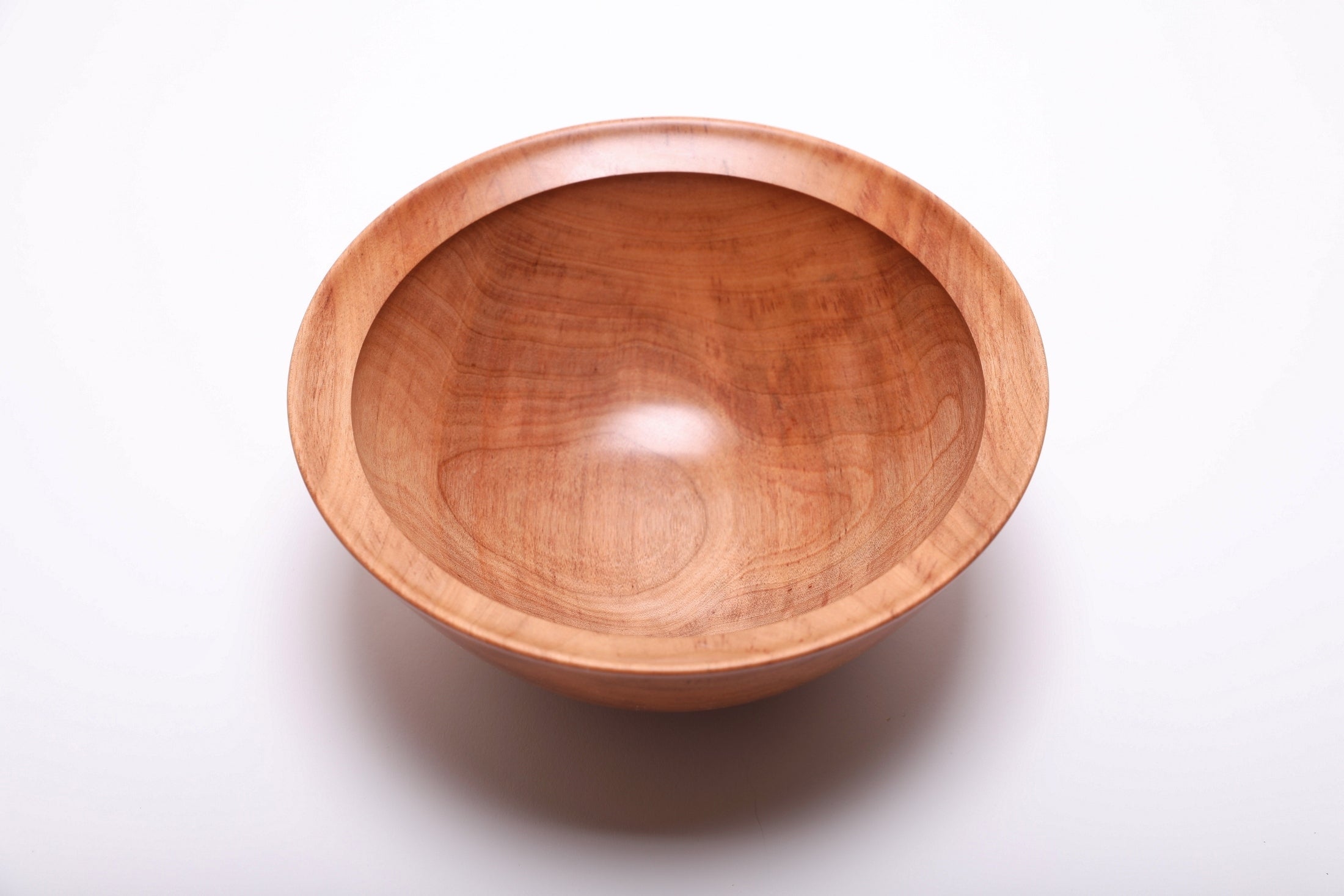 Top-down view of river birch wood bowl rotated 270 degrees displaying iridescent figure and natural color variation