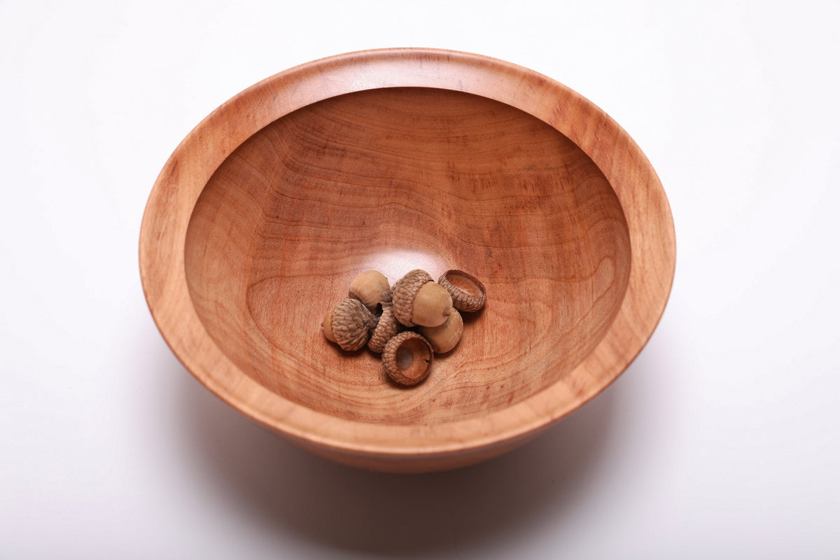 River birch wooden bowl with acorns for scale showing bowl size and depth, 8 1/8 inches wide by 3 1/2 inches tall