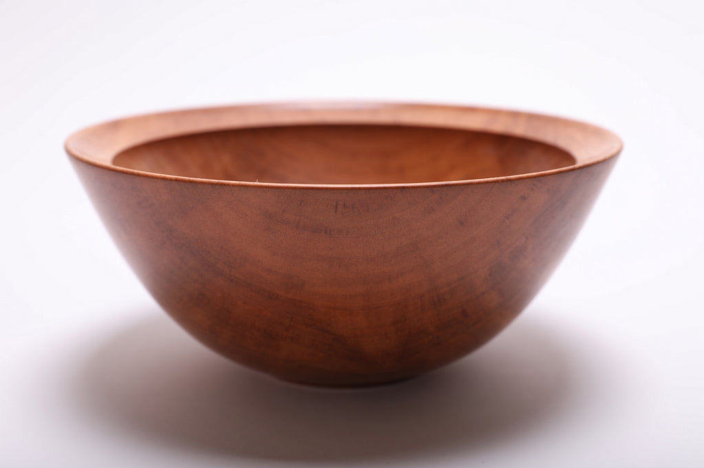 Side profile of hand-turned river birch bowl rotated 90 degrees revealing wall thickness and elegant curved silhouette
