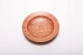 Quartersawn wild black cherry wood ring dish top view showing warm pink and copper tones with straight growth rings, hand-turned, 5 3/8 inches diameter