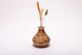 Spalted hackberry wood weed pot with dried flowers, front view showing ink-black spalting lines and gray and amber splotches, 4 1/4 inches tall