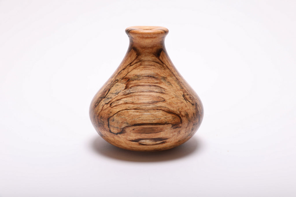 Side view of spalted hackberry weed pot showing ink-black spalting lines, gray and amber splotches, and natural form, handmade in NC USA