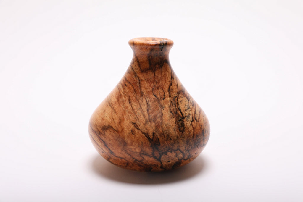 Side angle of spalted hackberry dry vase rotated 270 degrees highlighting natural spalted wood figure and hand-turned form
