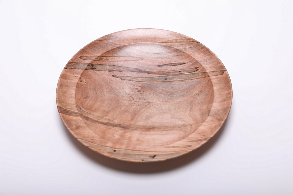 Ambrosia maple shallow wood dish top view showing natural beetle holes and fungus coloring, hand-turned with food-safe oil finish, 9 inches diameter