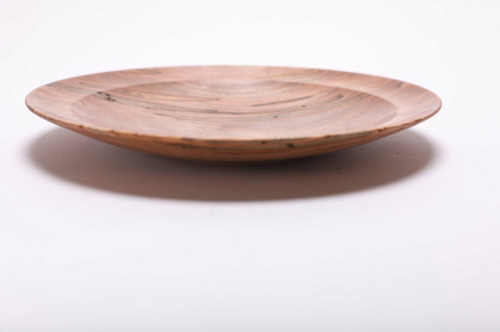 Side profile of hand-turned ambrosia maple dish rotated 90 degrees revealing ultra-shallow plate-like form and thin wall profile