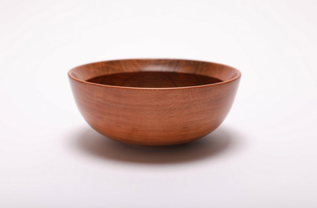 Small wild black cherry bowl side view showing spalted patch and warm grain character