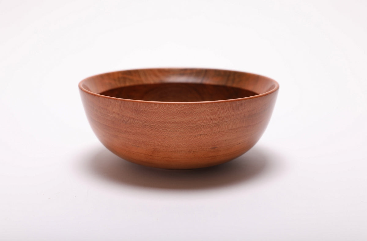 Small wild black cherry bowl side view showing spalted patch and warm grain character