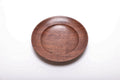 Top view of hand-turned quartersawn black walnut ring dish showing warm reddish-brown grain and curved taper rim, 5 7/8 inches