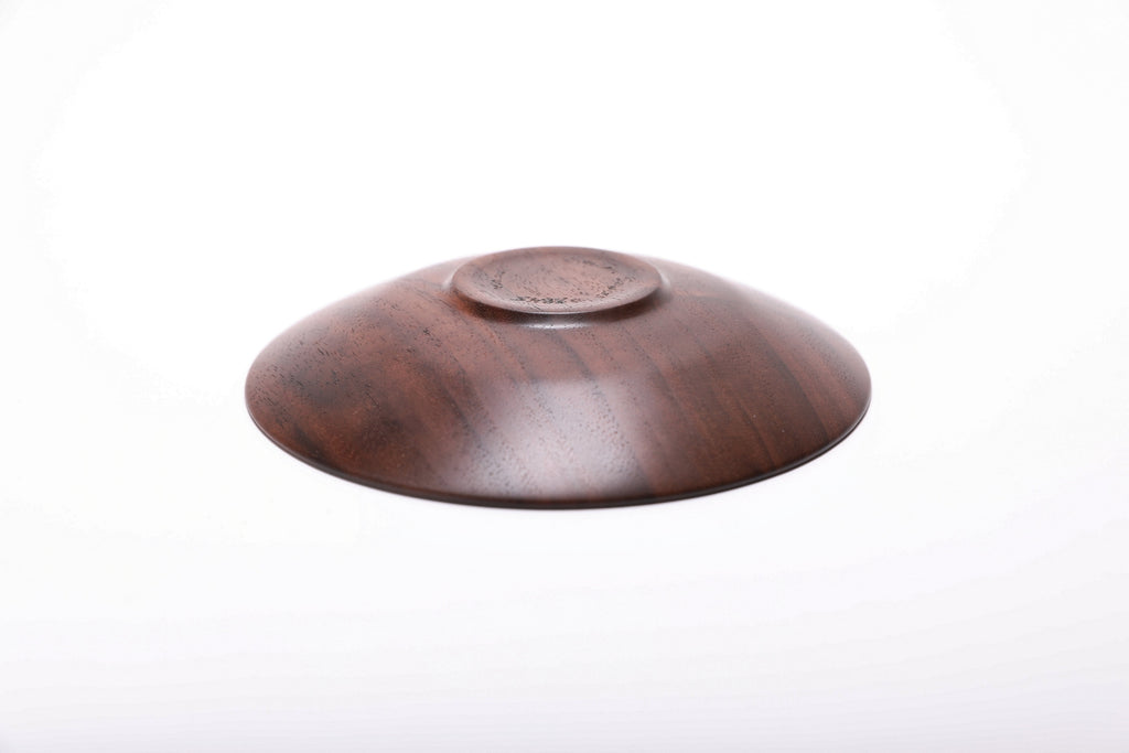 Bottom view of handmade quartersawn black walnut ring dish showing raised foot and natural oil finish