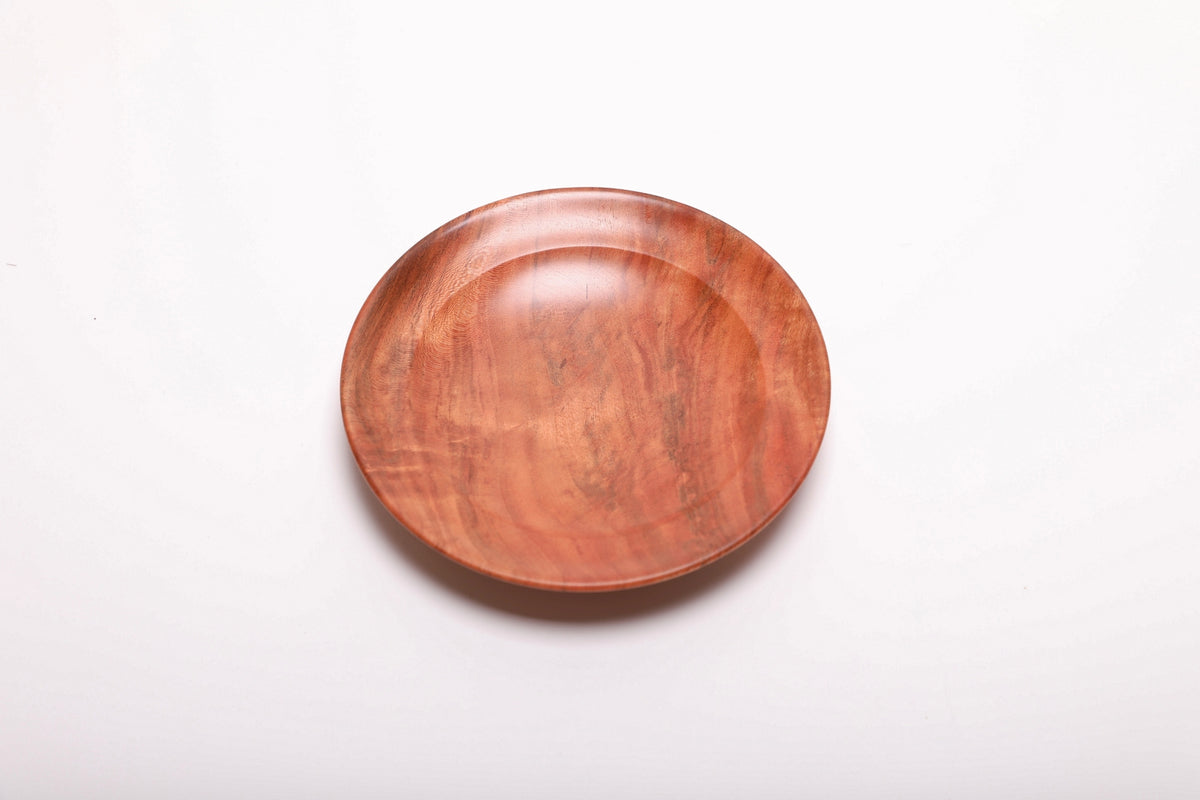 Top view of hand-turned black cherry burl ring dish with smooth oil finish and organic edge crotch burl grain pattern