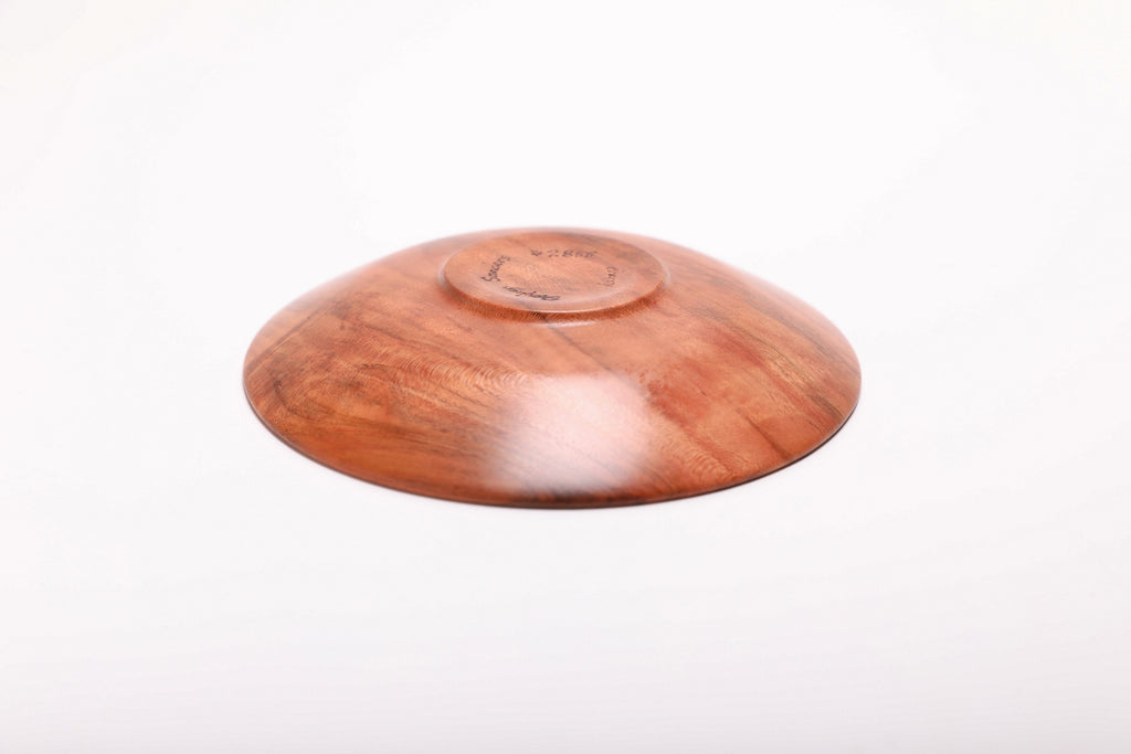 Bottom view of handmade wild black cherry burl ring dish showing raised foot and natural oil finish
