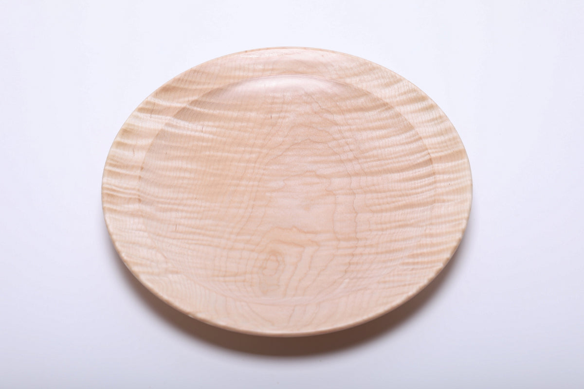 Top view of hand-turned tiger maple wooden platter showing cream and honey grain with subtle curly tiger figure, 9 3/8 inches