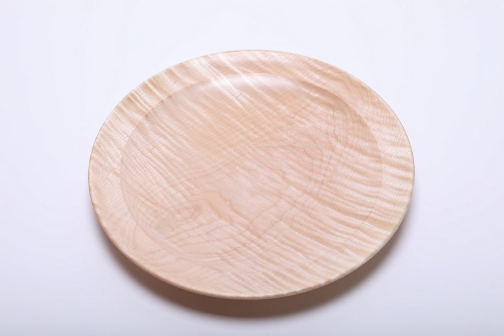 Top view of tiger maple platter highlighting chatoyant figure with rippling cream and honey tones across the surface