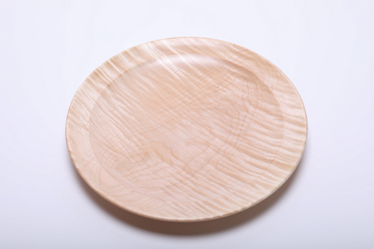 Top view of tiger maple platter highlighting chatoyant figure with rippling cream and honey tones across the surface