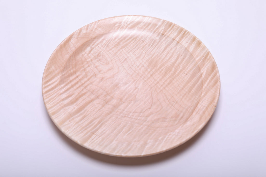 Top view of hand-turned tiger maple platter with strong tiger figure shimmer and rounded undercut rim detail
