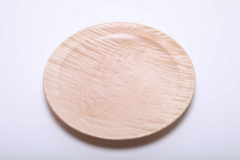 Top view of handmade tiger maple platter with chatoyant grain and curved taper, natural oil finish, 9 3/8 inches