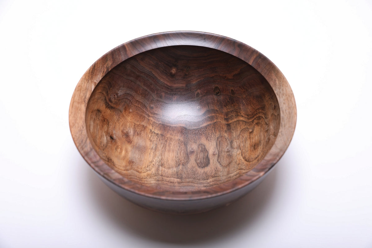 Top view of spalted black walnut bowl highlighting swirling spalted sapwood figure and warm brown tones with bud scar detail