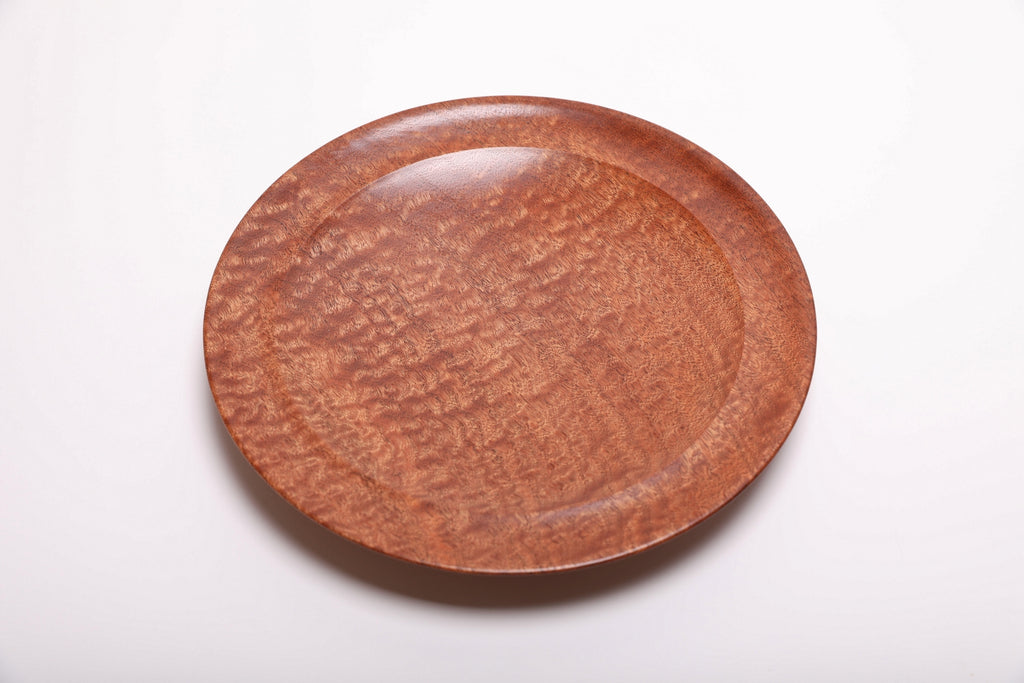 Top view of pommele sapele bowl highlighting rich copper and mahogany dapple pattern with smooth natural oil finish