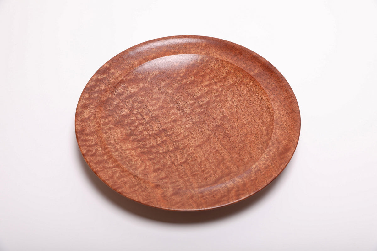 Top view of pommele sapele bowl highlighting rich copper and mahogany dapple pattern with smooth natural oil finish