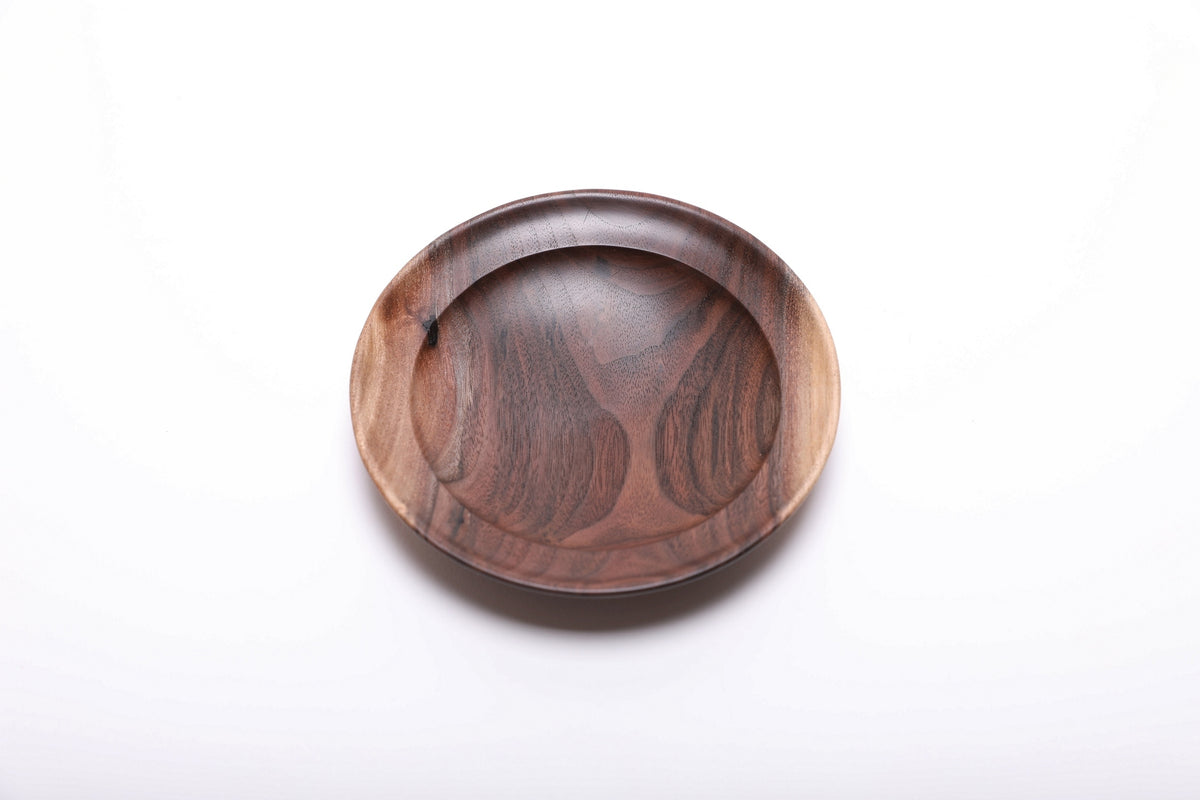 Top view of hand-turned wild black walnut ring dish with prominent sapwood and heartwood contrast and smooth undercut rim