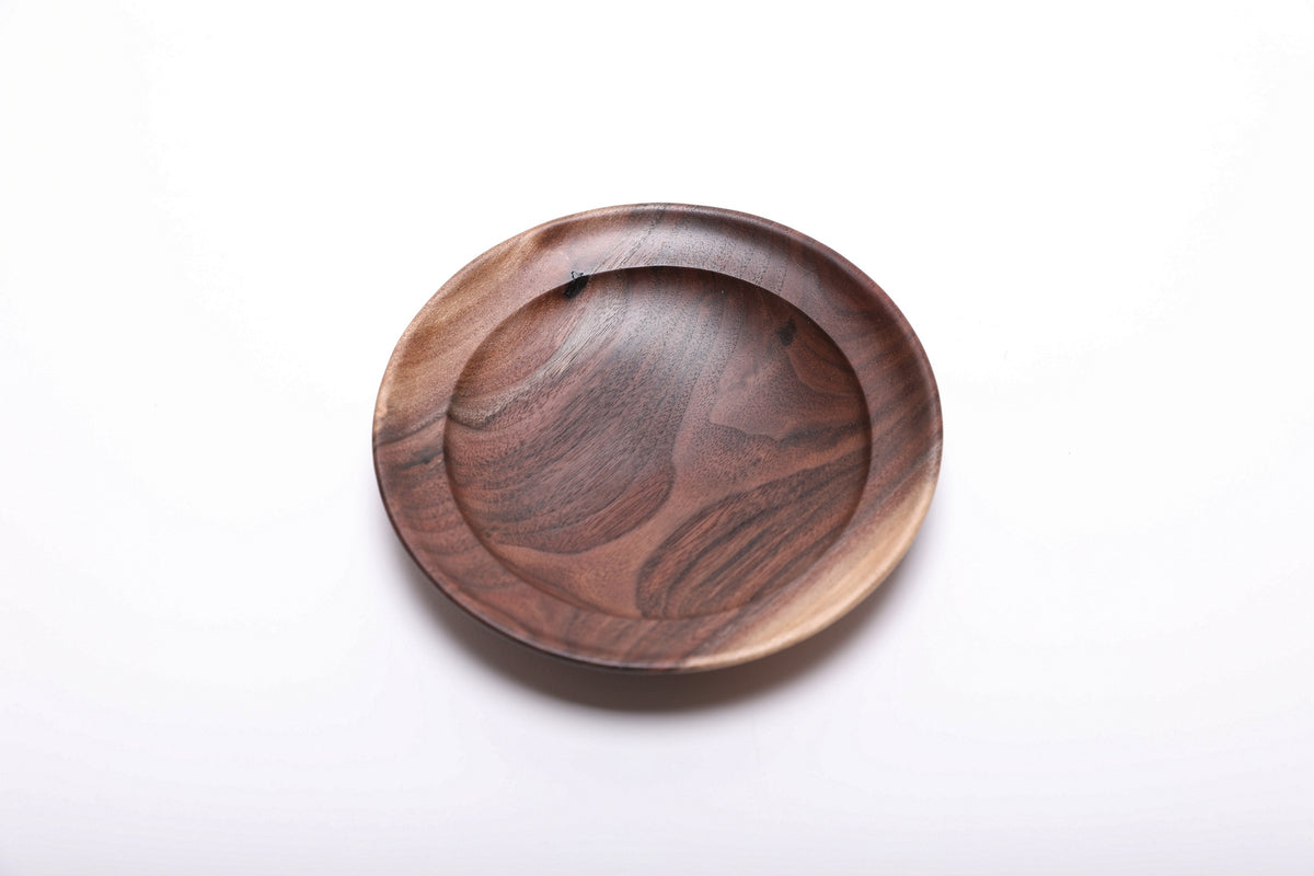 Top view of wild black walnut ring dish showing sapwood and dark heartwood contrast with flowing grain and natural oil finish